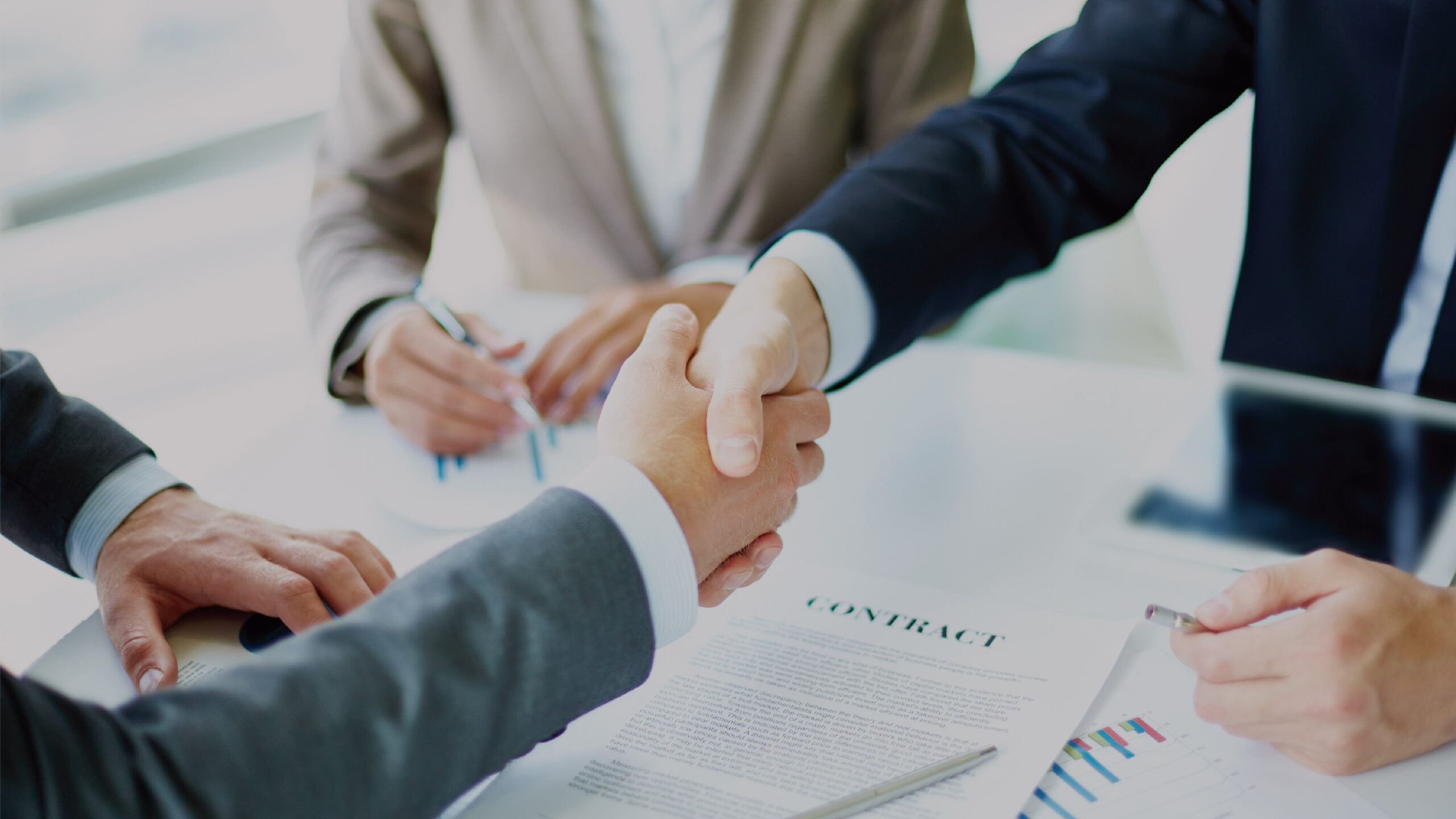 People shaking hands after completing a house deal - Full Sail Commercial Real Estate